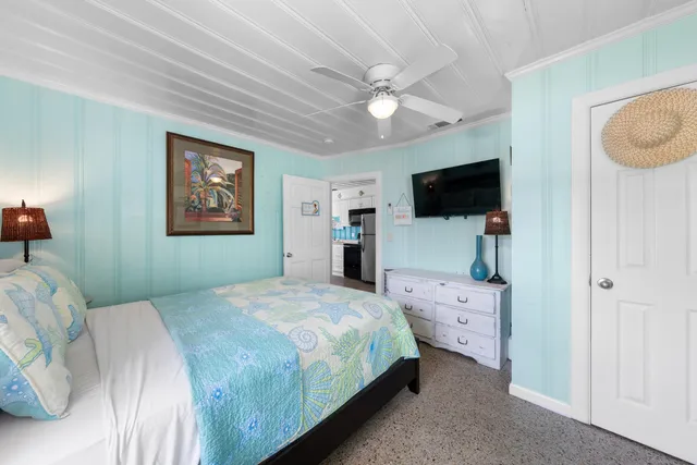a view of a dining room with furniture and a potted plant