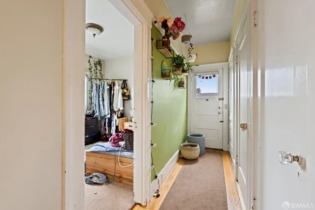 a bathroom with a sink mirror and toilet