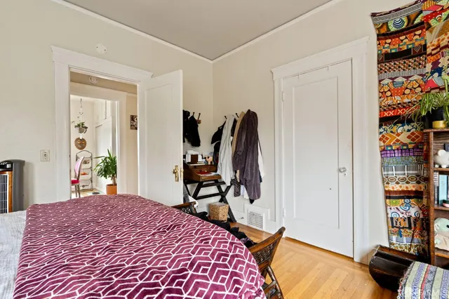 a living room with furniture and a book shelf