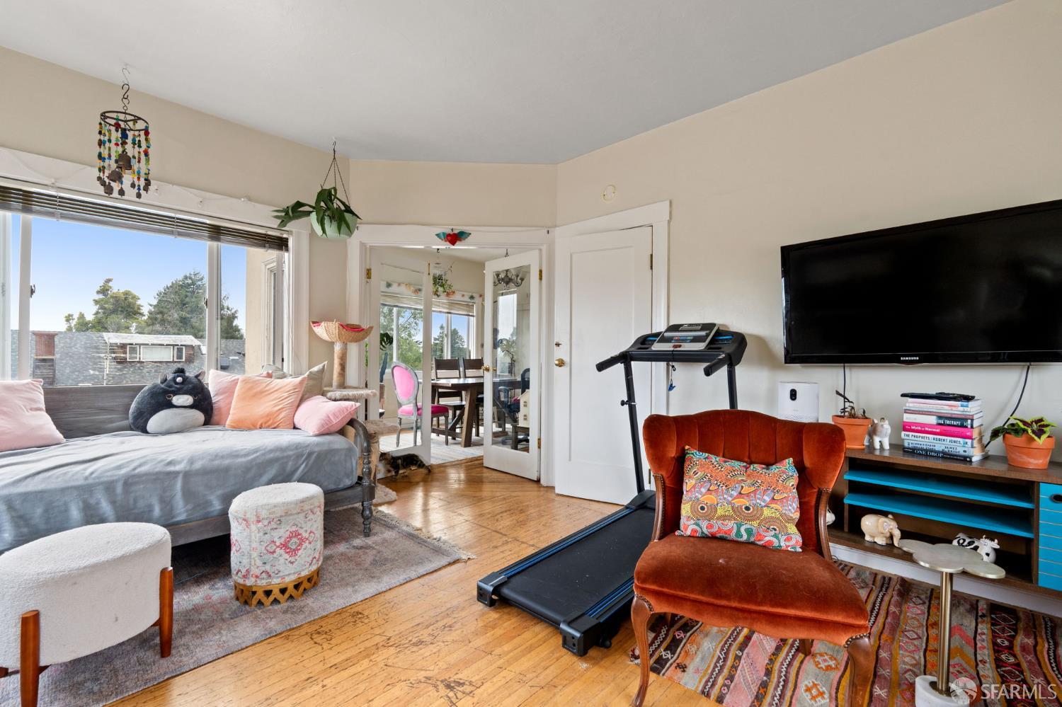 1849 Cedar Street Berkeley, CA 94703 - Photo 35 of 65 a living room with furniture and a flat screen tv