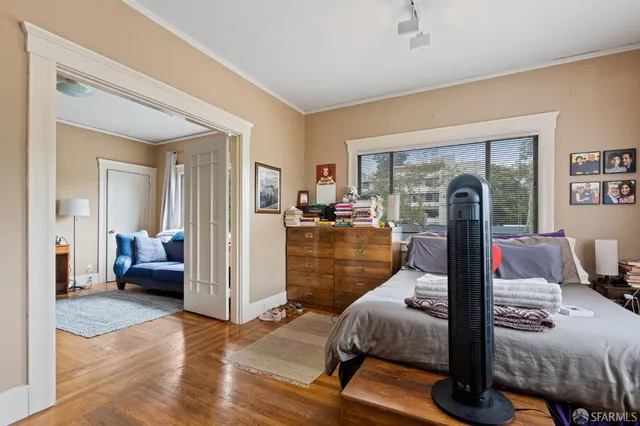 a bedroom with a bed and a couch