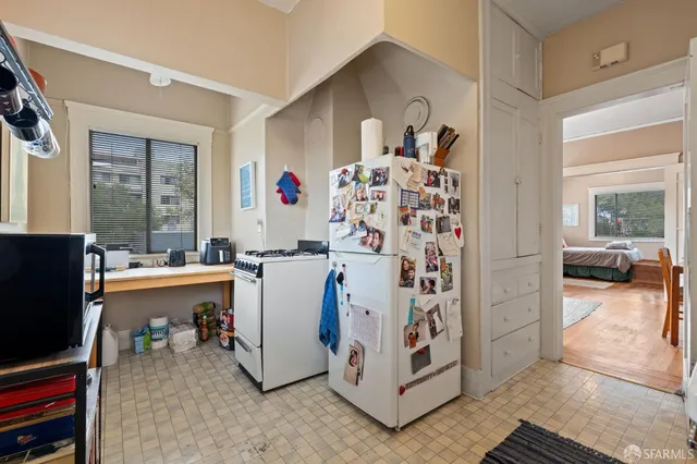 a room that has a window in it and a wooden floor