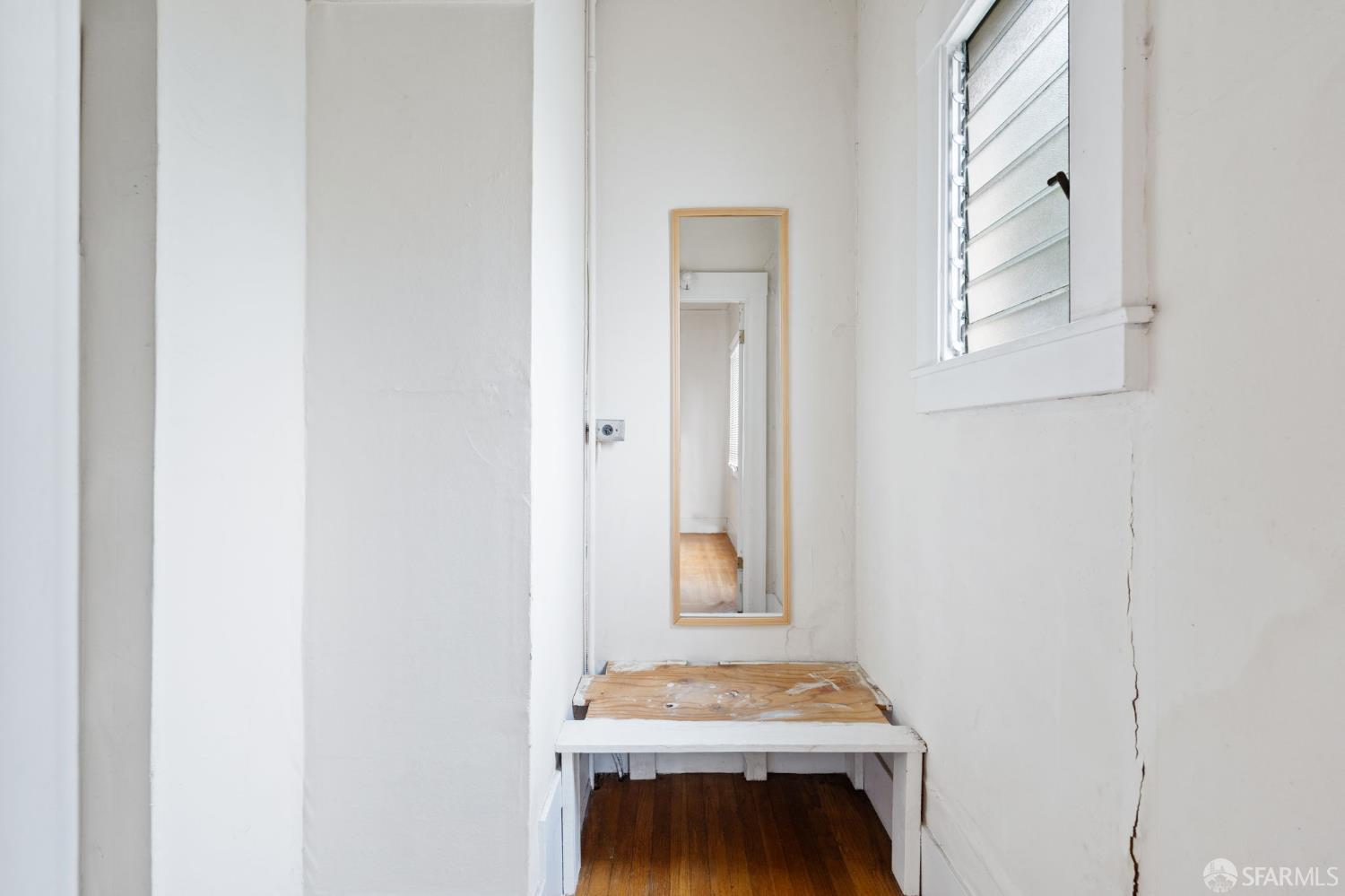 1849 Cedar Street Berkeley, CA 94703 - Photo 55 of 65 a room that has a window in it and a wooden floor