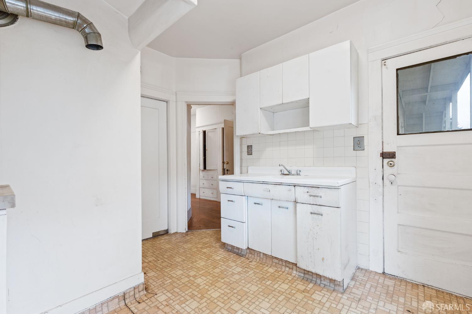 1849 Cedar Street Berkeley, CA 94703 - Photo 59 of 65 a room with a sink cabinets and a window