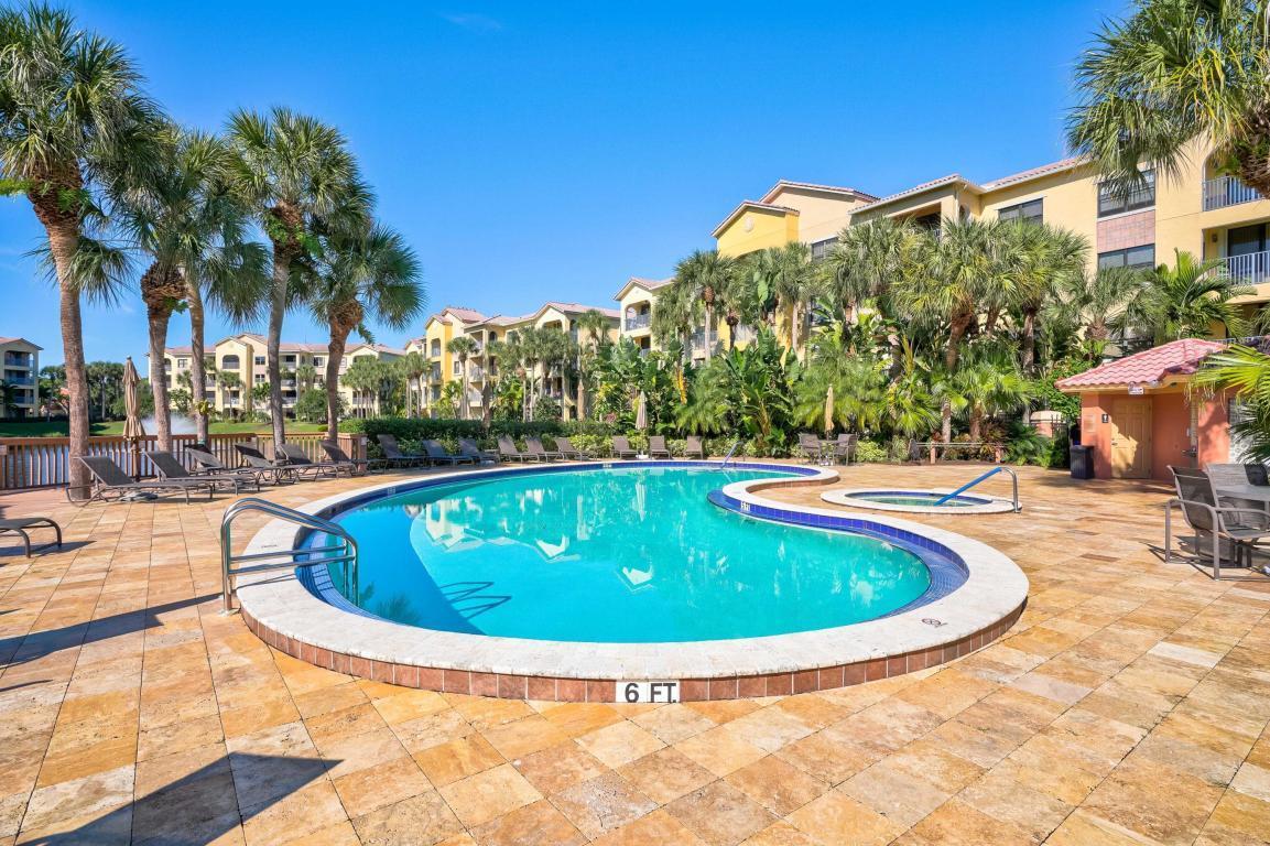 500 Uno Lago Drive, Unit 402 Juno Beach, FL 33408 - Photo 33 of 39 a view of outdoor space yard swimming pool and furniture