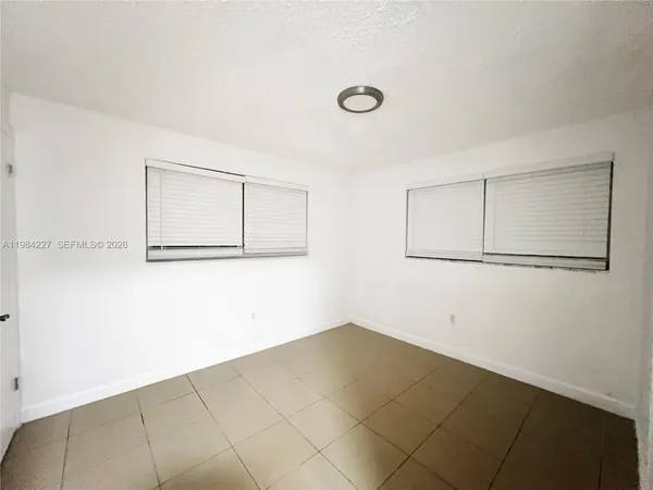 an empty room with a bench