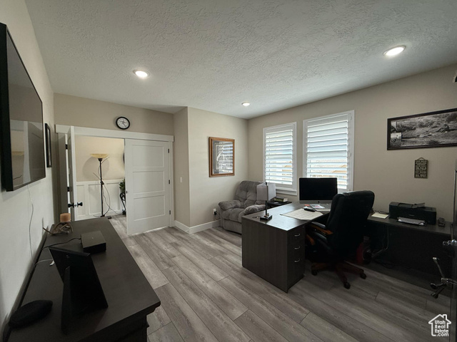 1240 West 2360 North Helper, UT 84526 - Photo 17 of 79 Home office featuring recessed lighting, baseboards, light wood-style floors, and a textured ceiling
