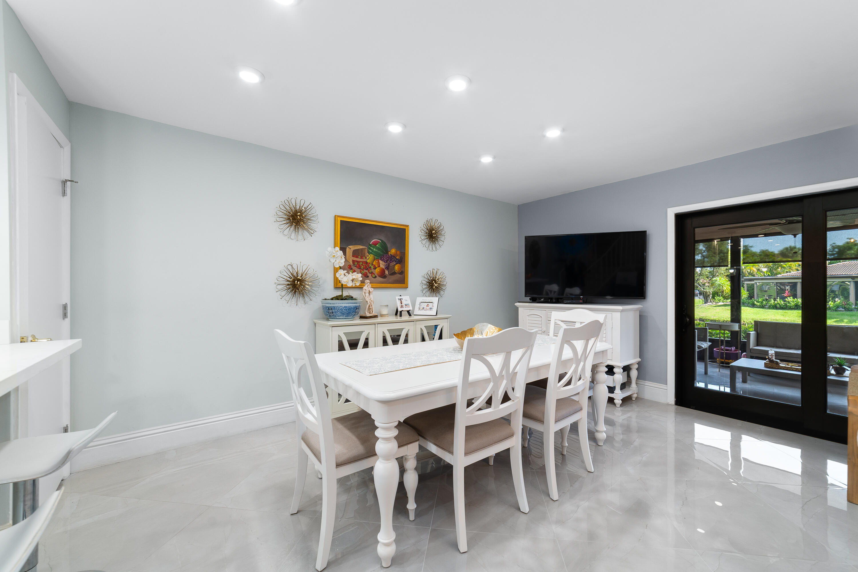 21160 Juego Circle, Unit 13C Boca Raton, FL 33433 - Photo 12 of 41 a view of a dining room with furniture window and outside view