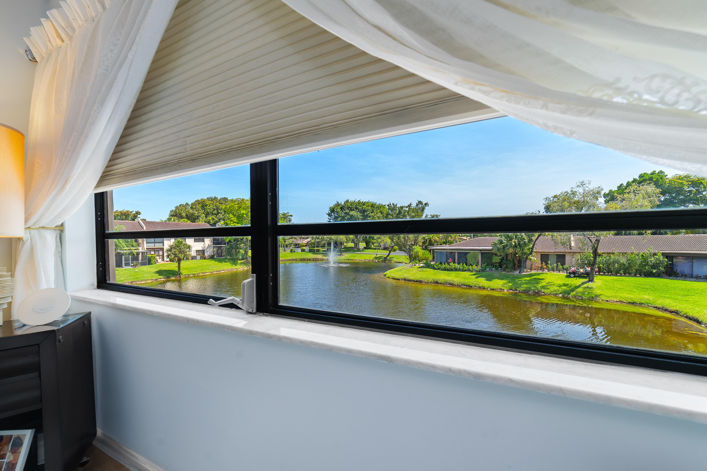21160 Juego Circle, Unit 13C Boca Raton, FL 33433 - Photo 16 of 41 a view of swimming pool with outdoor seating