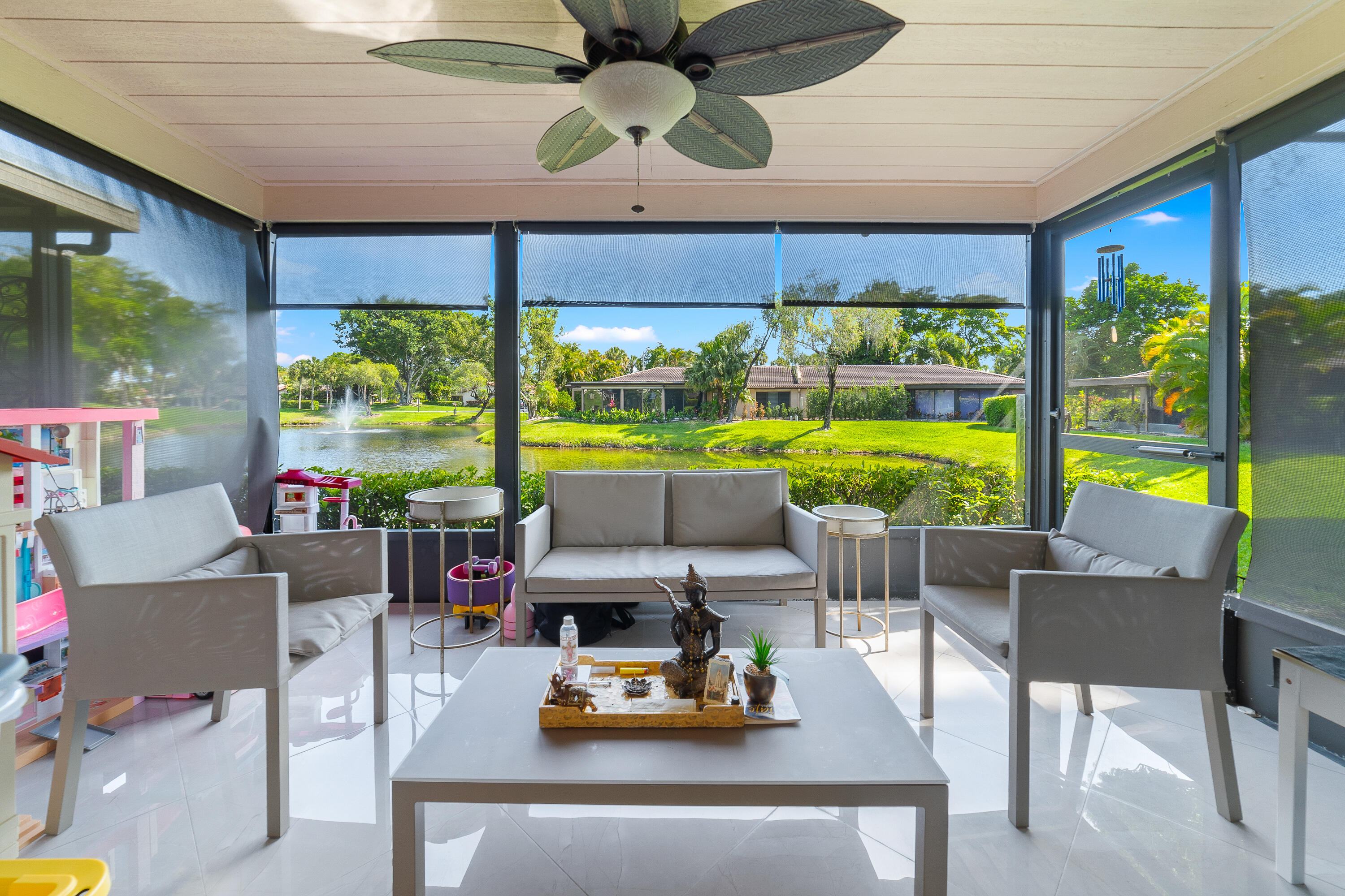 21160 Juego Circle, Unit 13C Boca Raton, FL 33433 - Photo 22 of 41 a room with furniture and a large window