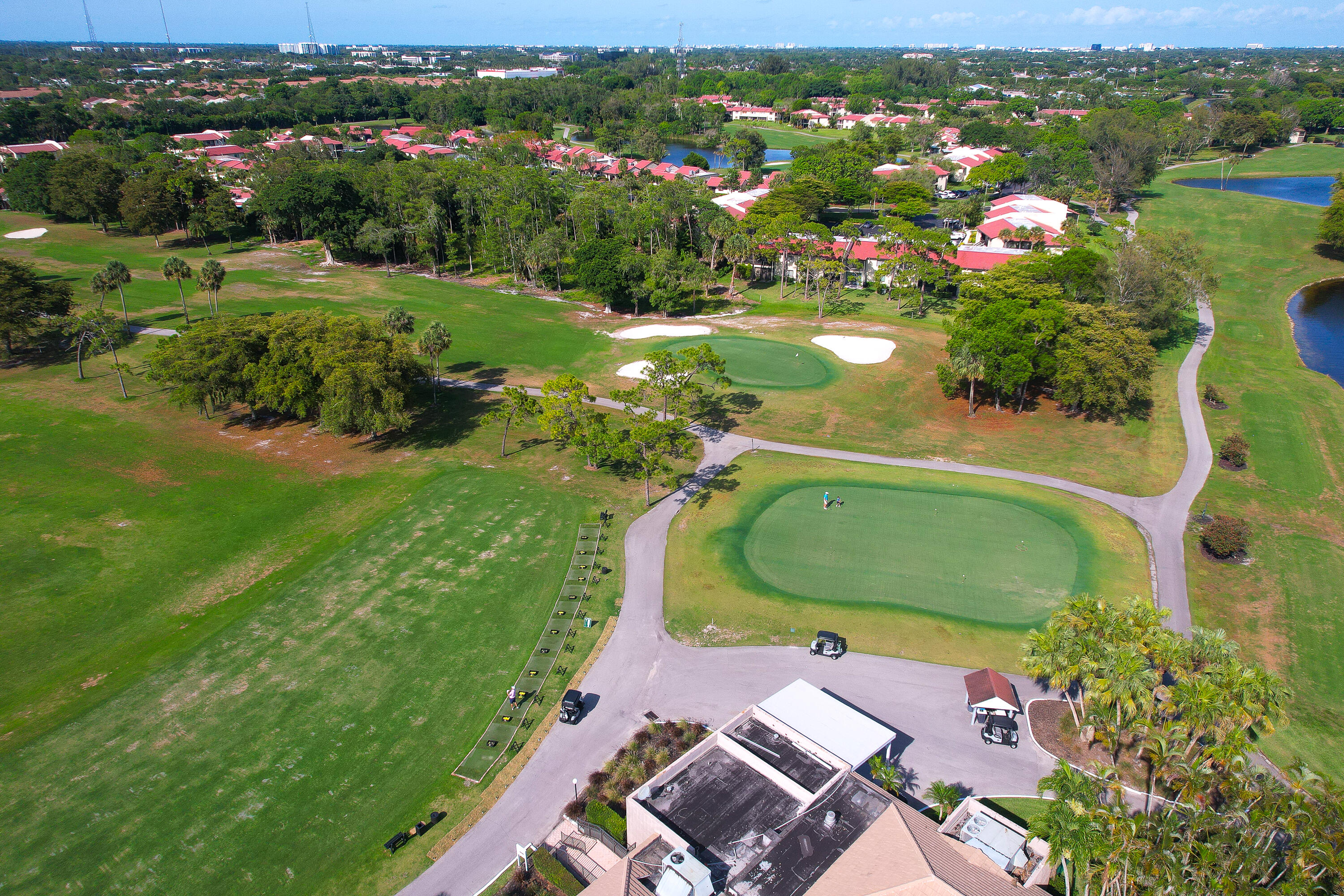 21160 Juego Circle, Unit 13C Boca Raton, FL 33433 - Photo 38 of 41 an aerial view of a houses with a lake view
