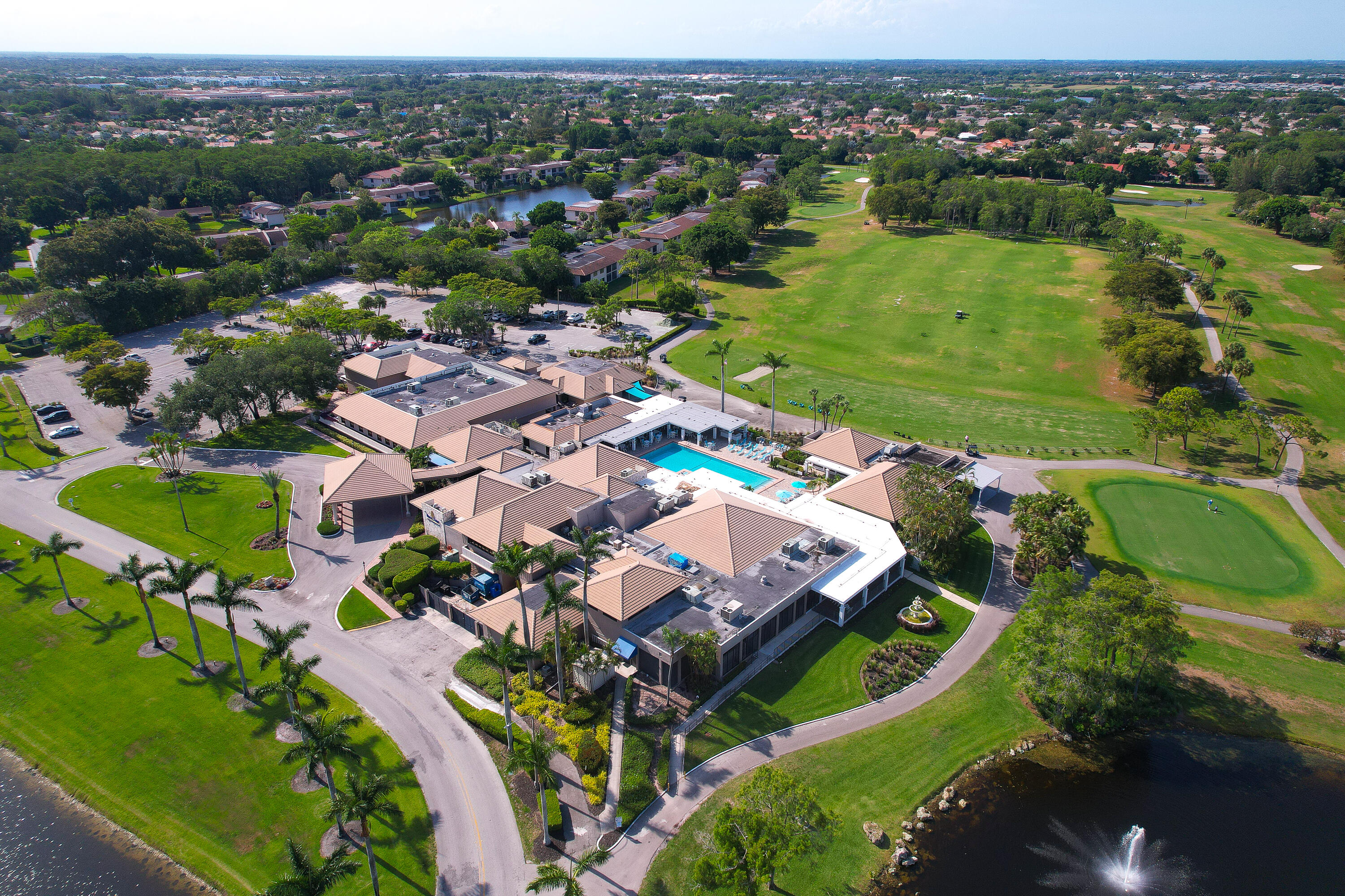 21160 Juego Circle, Unit 13C Boca Raton, FL 33433 - Photo 39 of 41 an aerial view of a house with a lake view