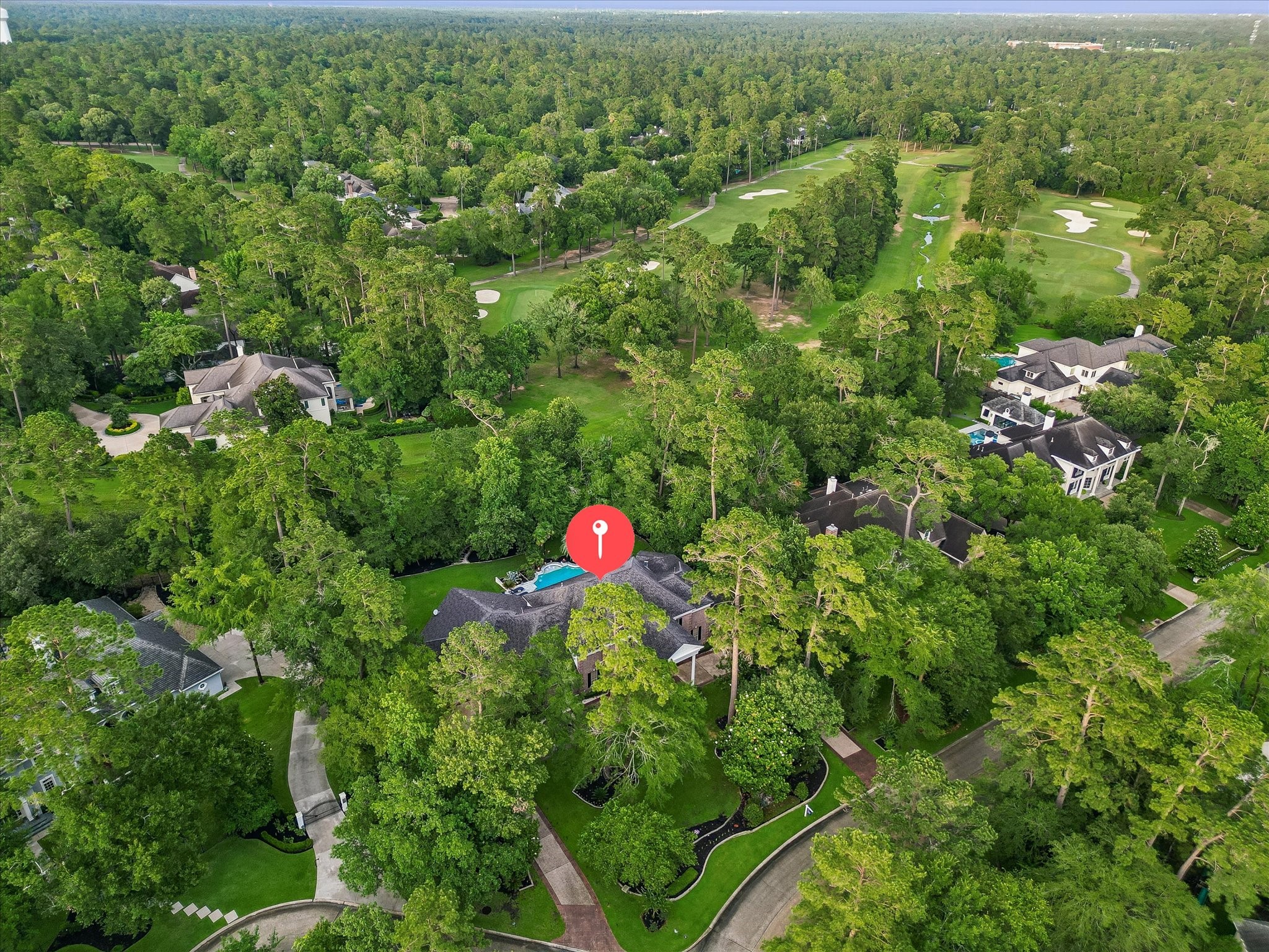35 North Regent Oak Spring, TX 77381 - Photo 40 of 43 Introducing 35 N Regent Oak, an exceptional residence nestled in the heart of the highly sought-after Cochran’s Crossing community in The Woodlands. This aerial view showcases the property's prime location surrounded by mature trees, established neighborhoods, and overlooking the golf course, the unparalleled lifestyle for which The Woodlands is renowned.