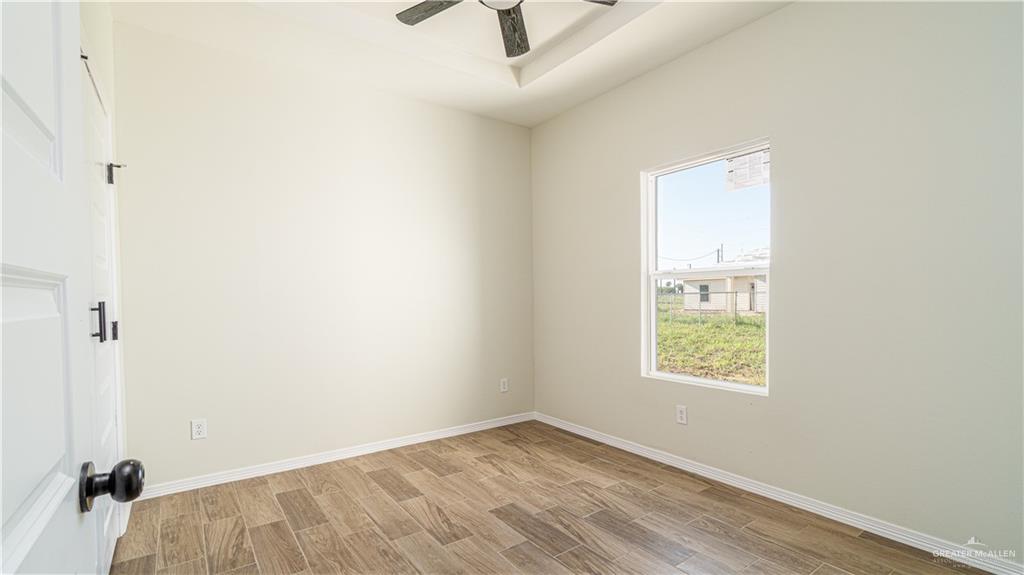 348 Merida Street Donna, TX 78537 - Photo 12 of 19 an empty room with a window