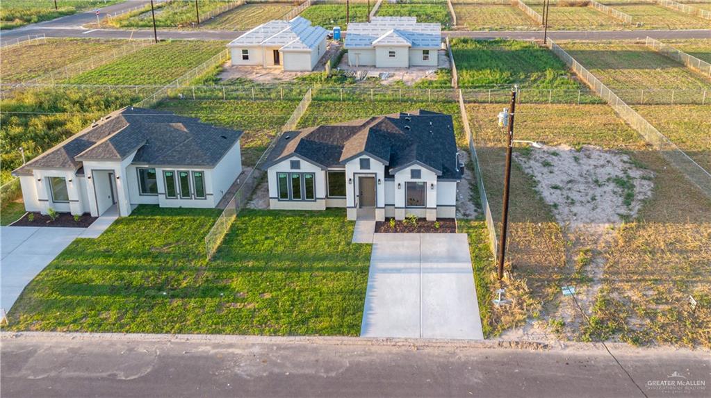 348 Merida Street Donna, TX 78537 - Photo 17 of 19 a front view of a house with garden