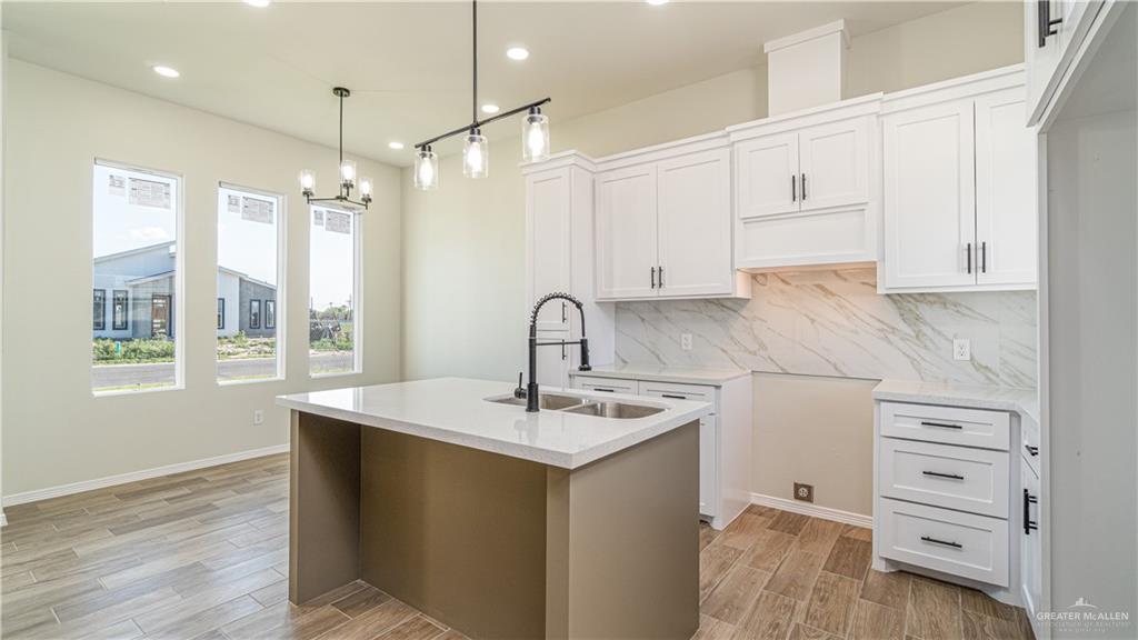 348 Merida Street Donna, TX 78537 - Photo 2 of 19 a kitchen with a sink a window and cabinets
