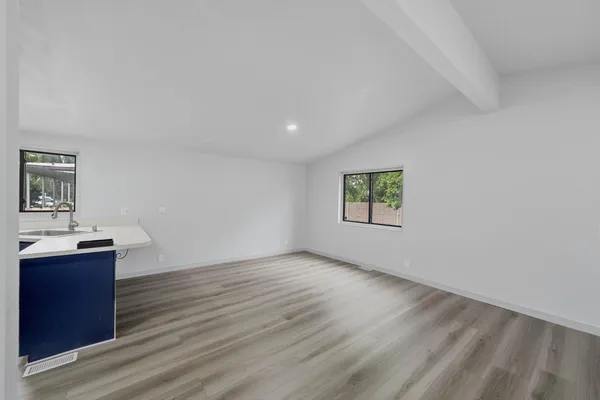 a view of kitchen with wooden floor