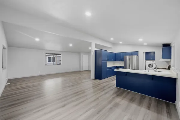 a view of kitchen with wooden floor