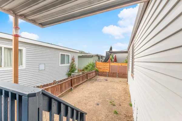 a view of a house with a yard and garage
