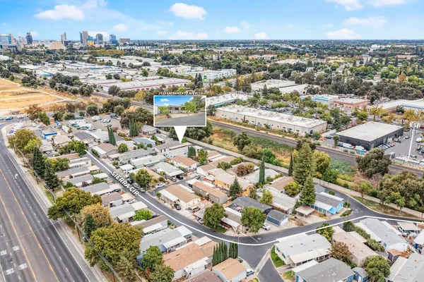 an aerial view of a house with a swimming pool
