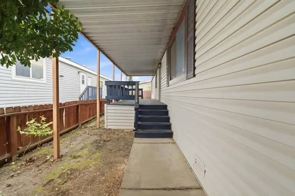 a view of a porch with wooden floor
