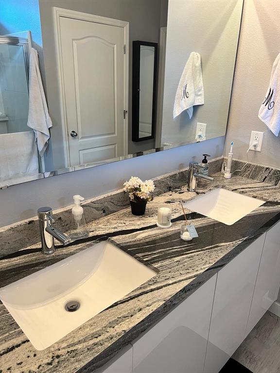 1404 Tawny Ridge Road Kissimmee, FL 34744 - Photo 14 of 21 a bathroom with a sink and a mirror