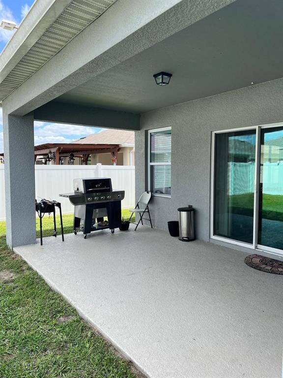 1404 Tawny Ridge Road Kissimmee, FL 34744 - Photo 17 of 21 a view of a livingroom with furniture and a garage