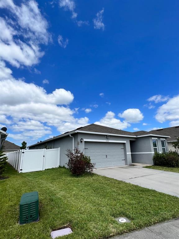 1404 Tawny Ridge Road Kissimmee, FL 34744 - Photo 3 of 21 a view of a back yard of the house