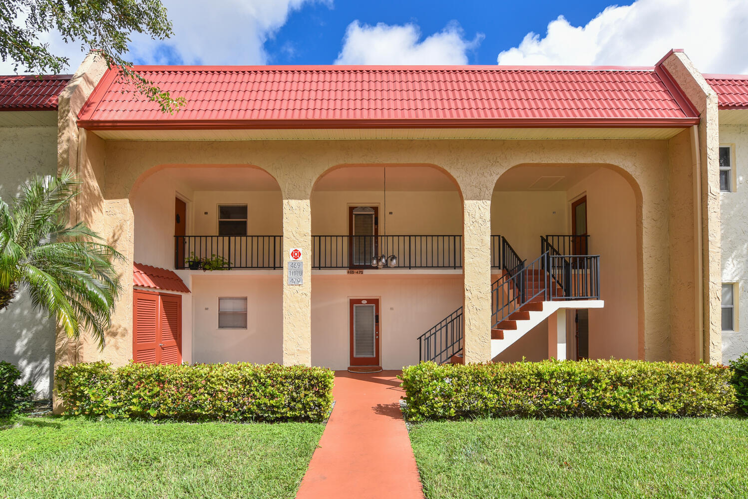 477 Lake Dora Drive West Palm Beach, FL 33411 - Photo 1 of 28 a view of a house with large windows