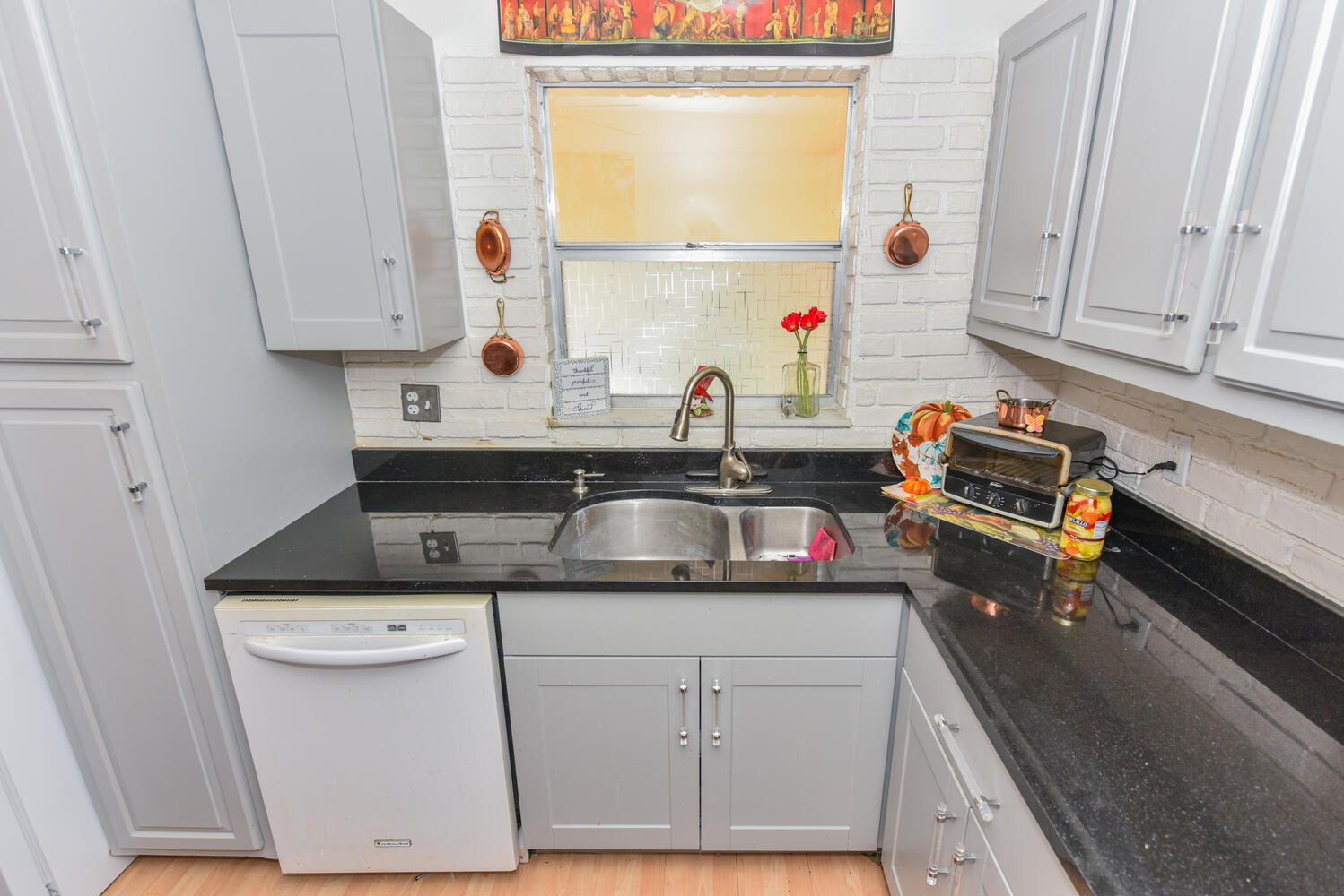 477 Lake Dora Drive West Palm Beach, FL 33411 - Photo 11 of 28 a kitchen with a sink and cabinets