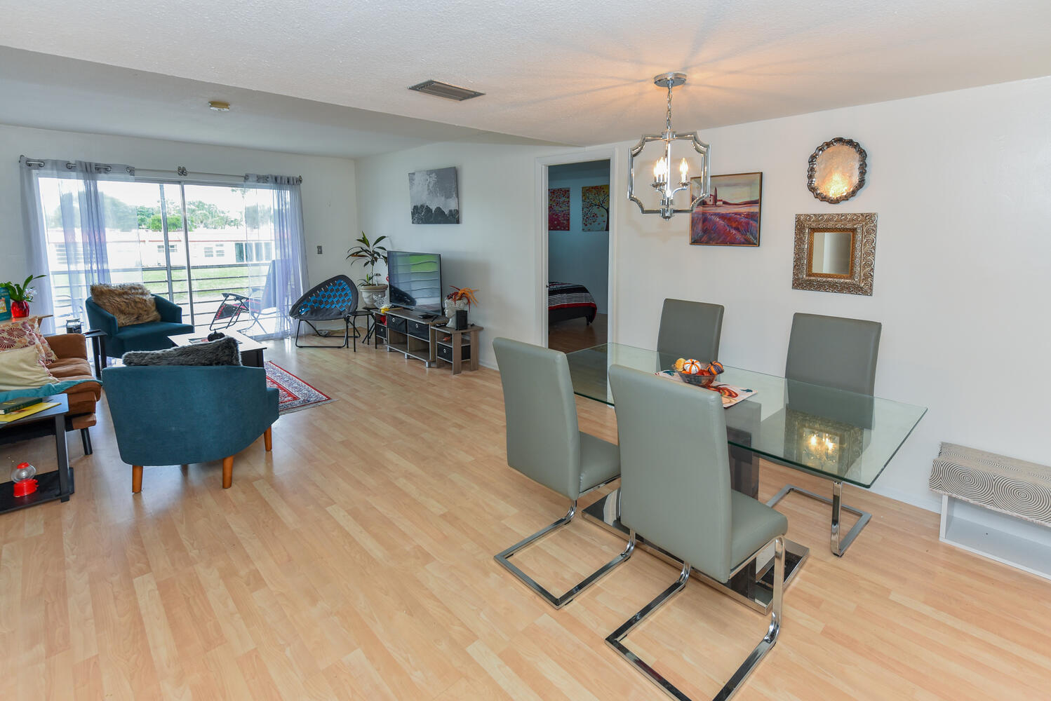 477 Lake Dora Drive West Palm Beach, FL 33411 - Photo 12 of 28 a workspace with furniture window and wooden floor