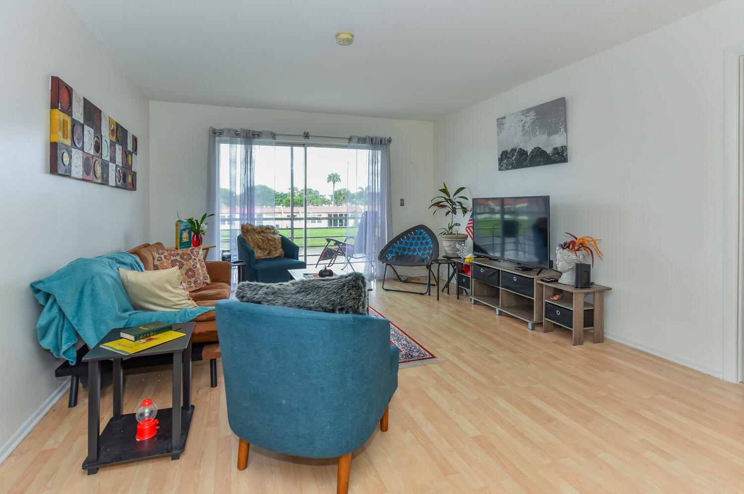 477 Lake Dora Drive West Palm Beach, FL 33411 - Photo 13 of 28 a living room with furniture and a wooden floor