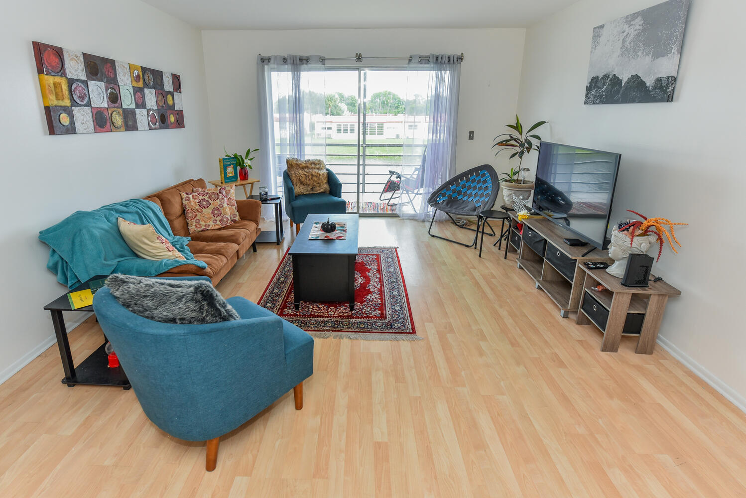 477 Lake Dora Drive West Palm Beach, FL 33411 - Photo 14 of 28 a living room with furniture and a wooden floor
