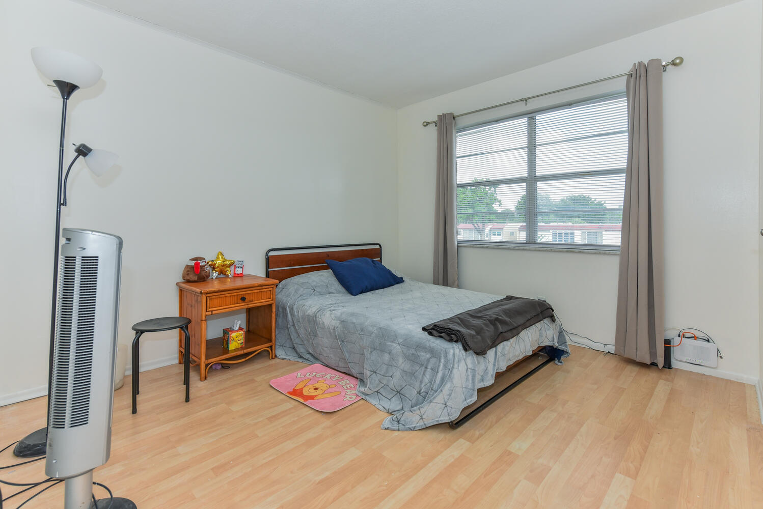 477 Lake Dora Drive West Palm Beach, FL 33411 - Photo 18 of 28 a bedroom with a bed and a window