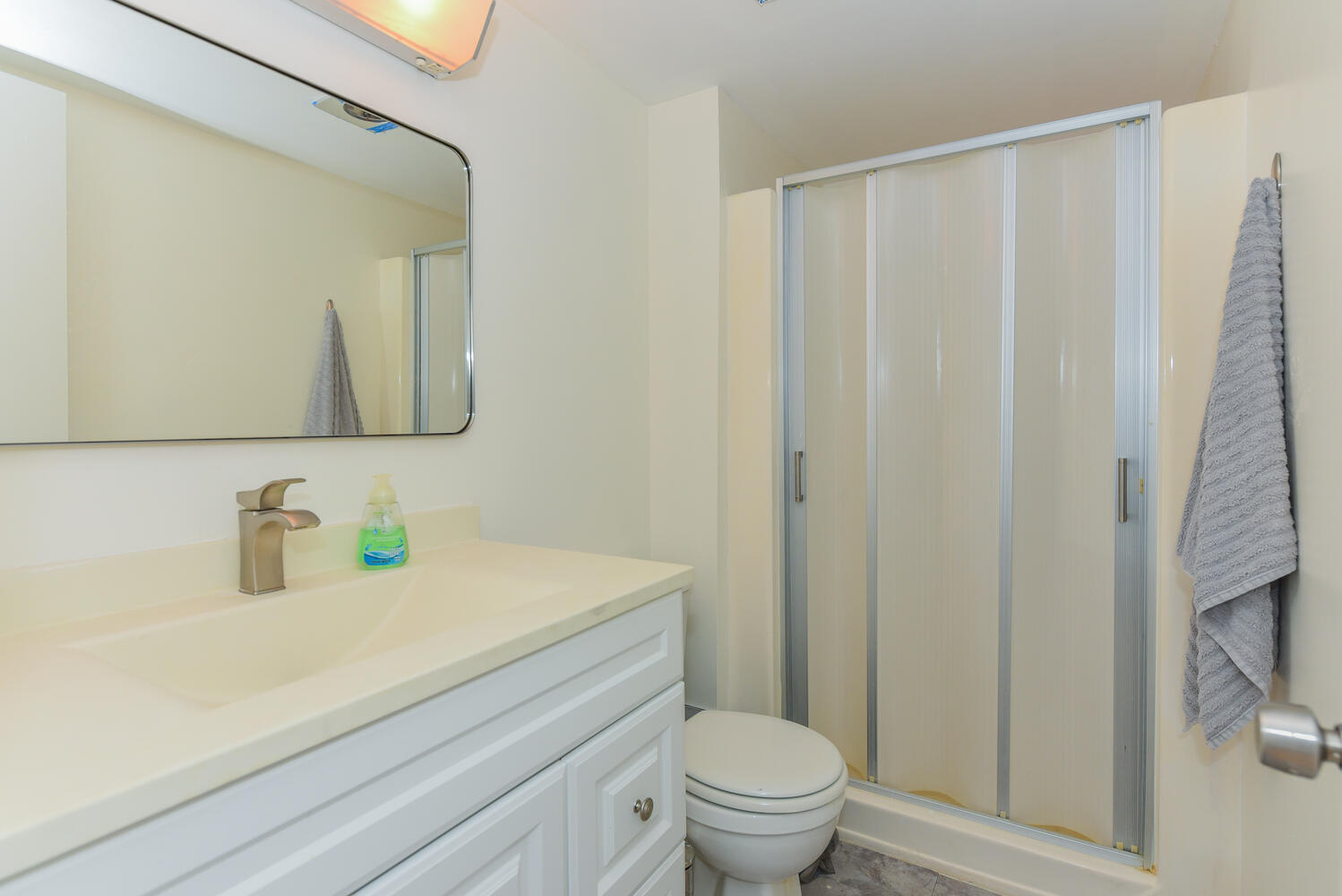 477 Lake Dora Drive West Palm Beach, FL 33411 - Photo 19 of 28 a bathroom with a sink a toilet and a mirror