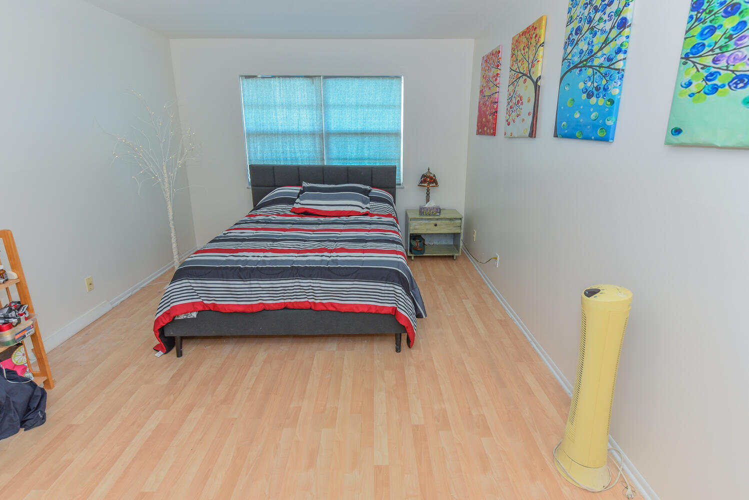 477 Lake Dora Drive West Palm Beach, FL 33411 - Photo 21 of 28 a bedroom with a bed and a window