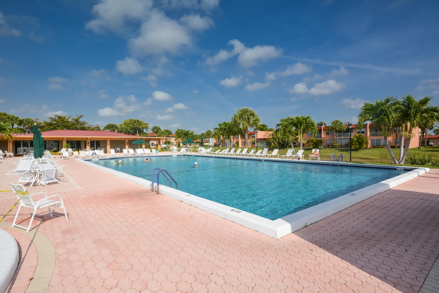477 Lake Dora Drive West Palm Beach, FL 33411 - Photo 5 of 28 a view of swimming pool with outdoor seating and city view