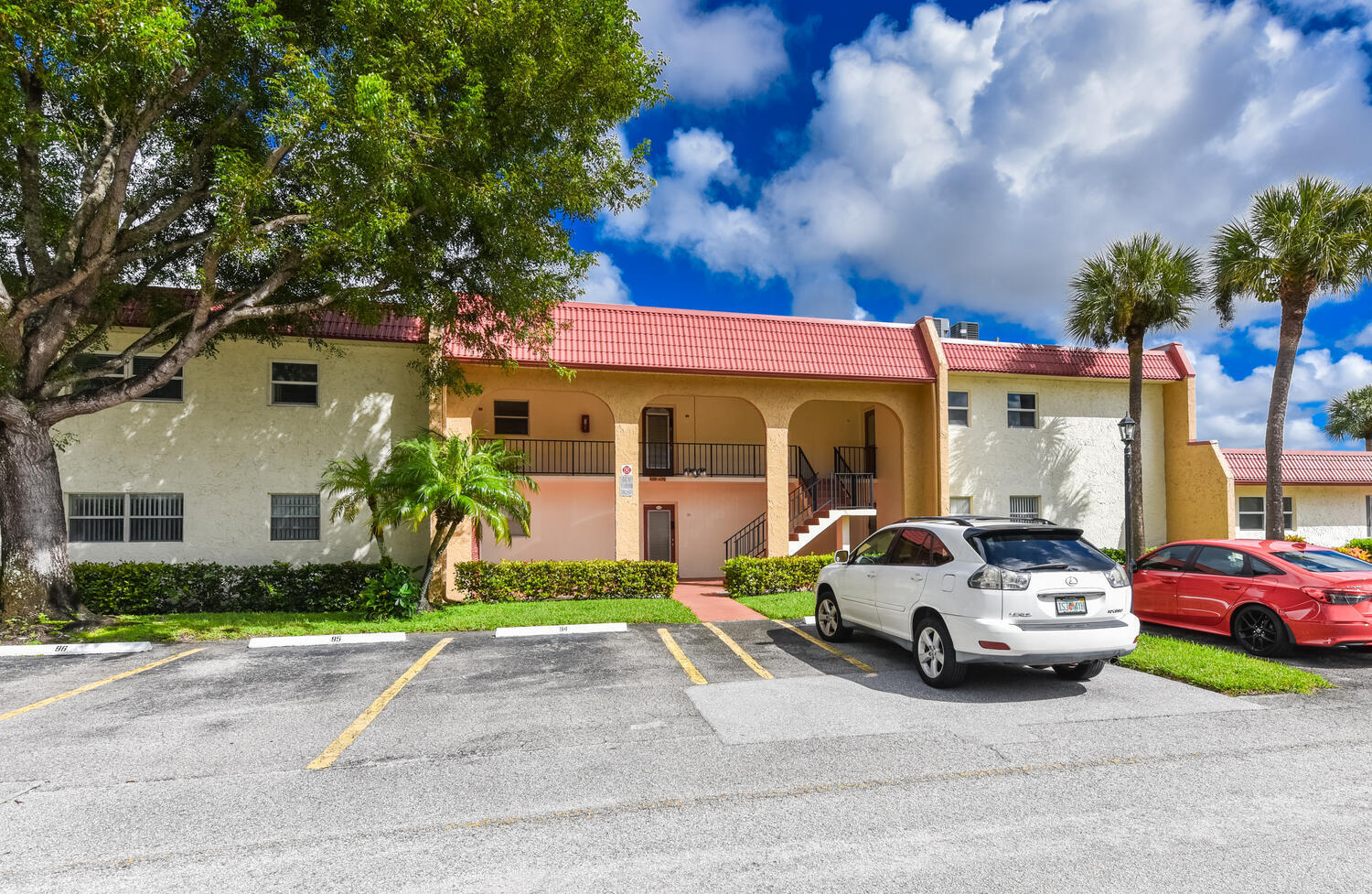 477 Lake Dora Drive West Palm Beach, FL 33411 - Photo 7 of 28 a car parked in front of a house