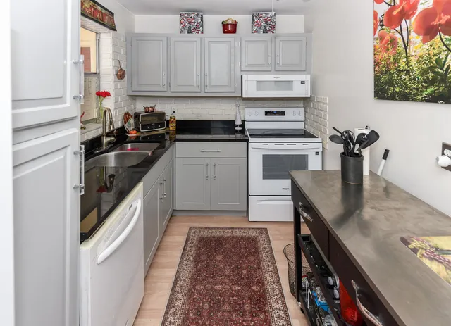 a kitchen with a sink and cabinets