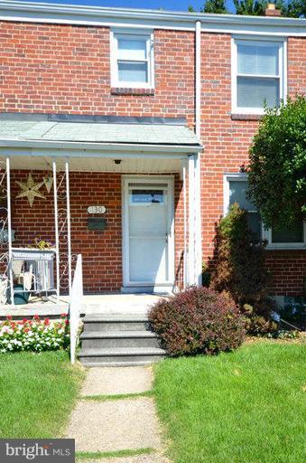 130 Garden Ridge Road Baltimore, MD 21228 - Photo 1 of 16 a view of a house with a yard