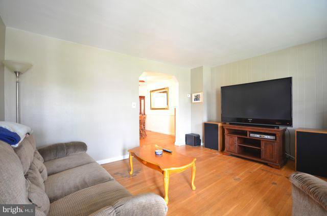130 Garden Ridge Road Baltimore, MD 21228 - Photo 2 of 16 a living room with furniture and a flat screen tv