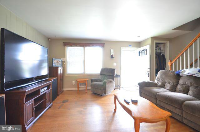 130 Garden Ridge Road Baltimore, MD 21228 - Photo 3 of 16 a living room with furniture and a flat screen tv