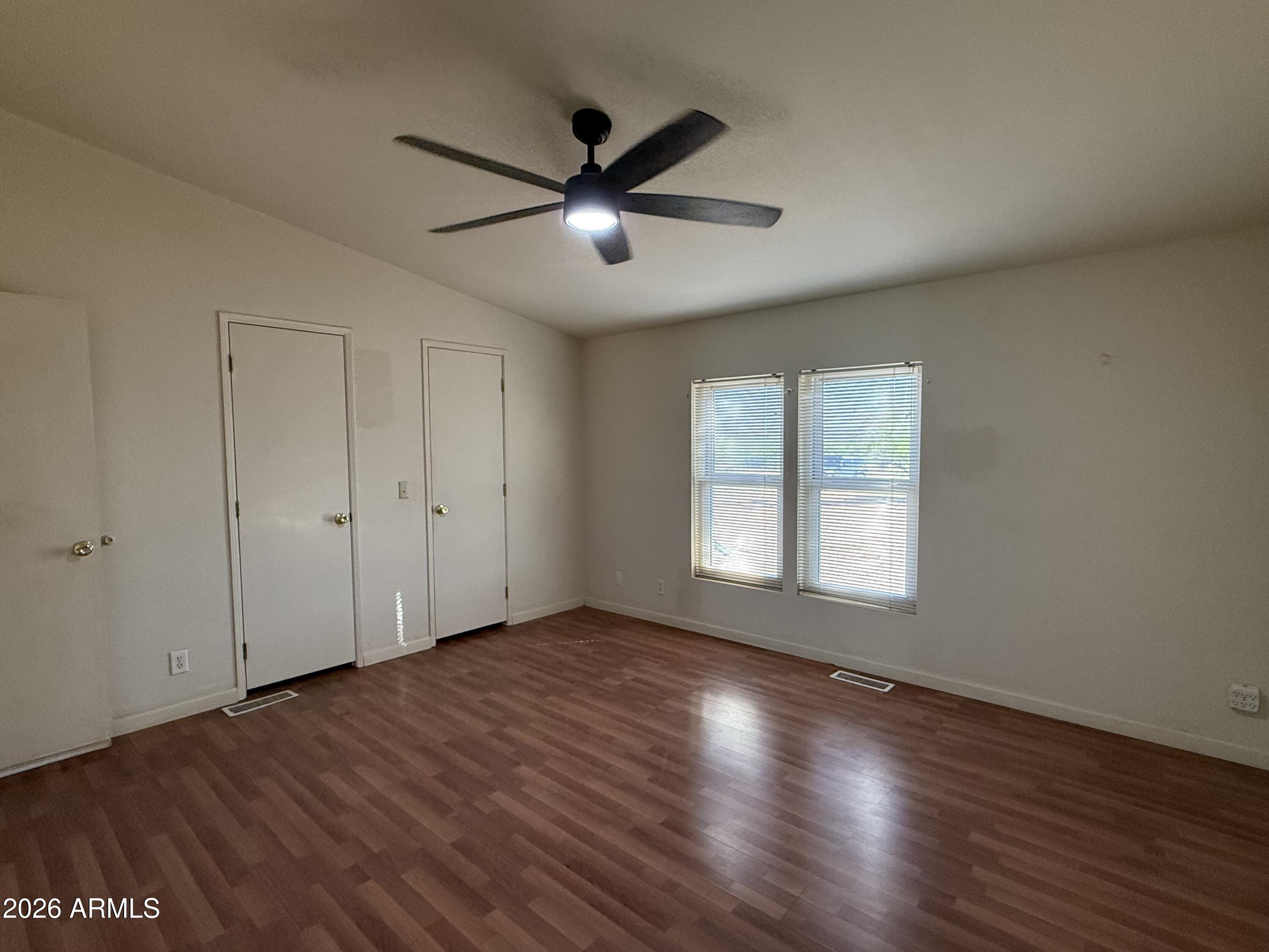 6206 South Ranch Road Hereford, AZ 85615 - Photo 8 of 14 a view of empty room with wooden floor and fan