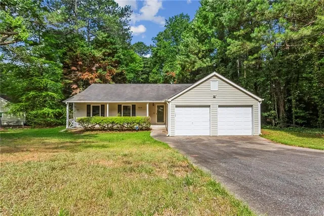a front view of a house with yard