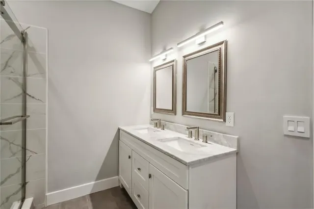 an empty room with window and ceiling fan