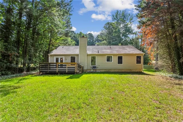 a view of outdoor space with garden and wooden deck
