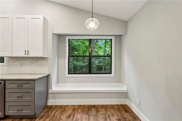 a bathroom with a bathtub and a window