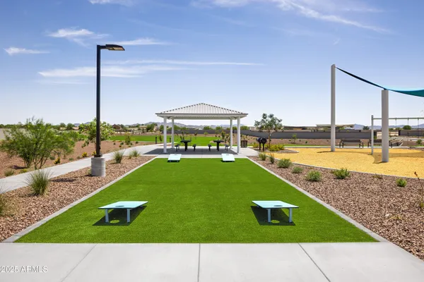 a swimming pool with outdoor seating and yard
