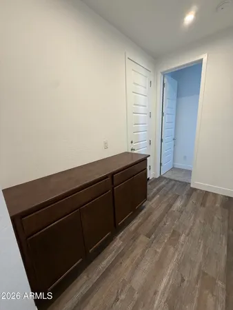 a view of room with wooden floor