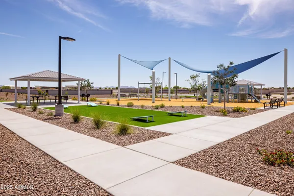 a view of a water fountain and a yard